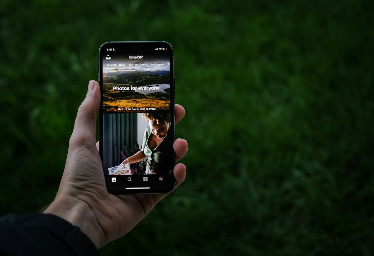 A hand using a mobile application on a smartphone